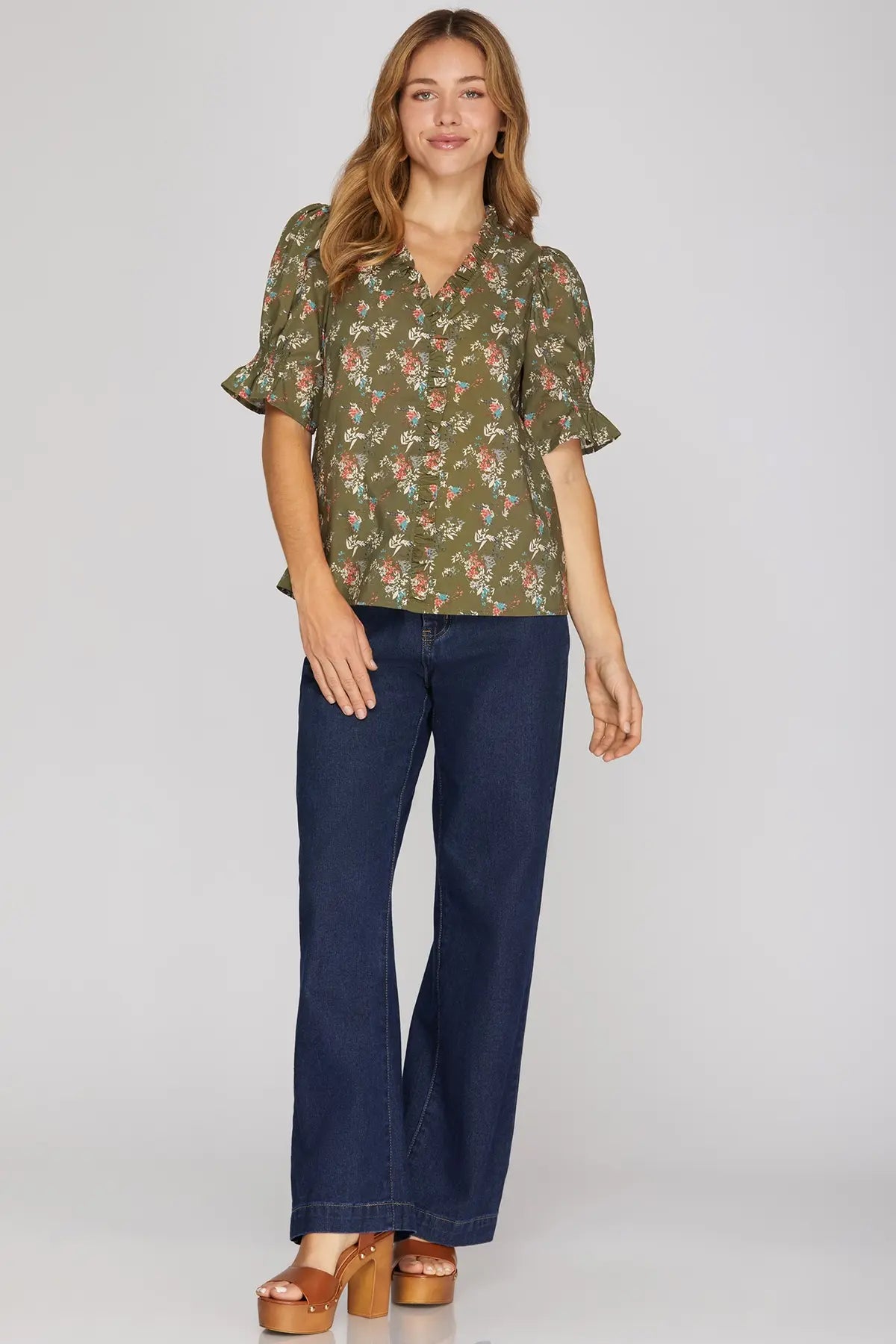 Brown floral ruffle-neck blouse fabric detail