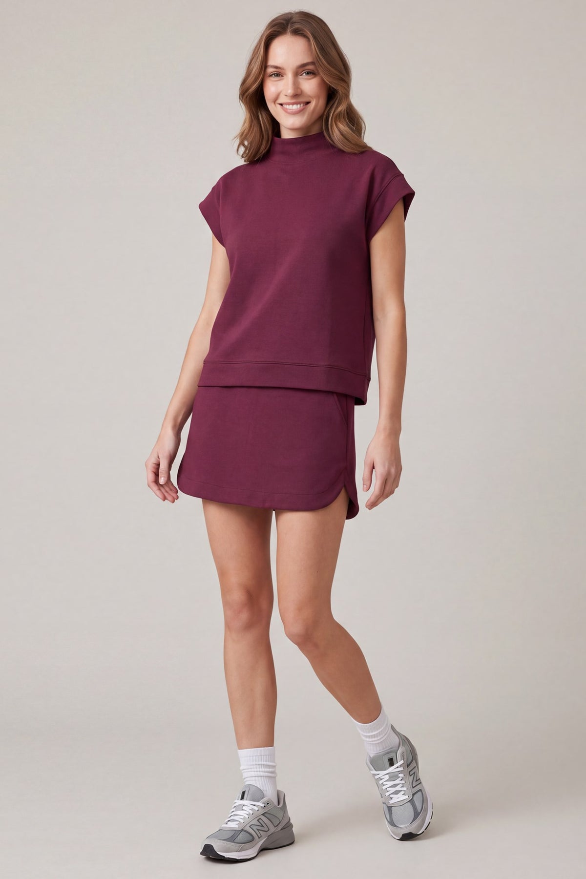 Wine mock-neck scuba knit top and mini skirt set detail view