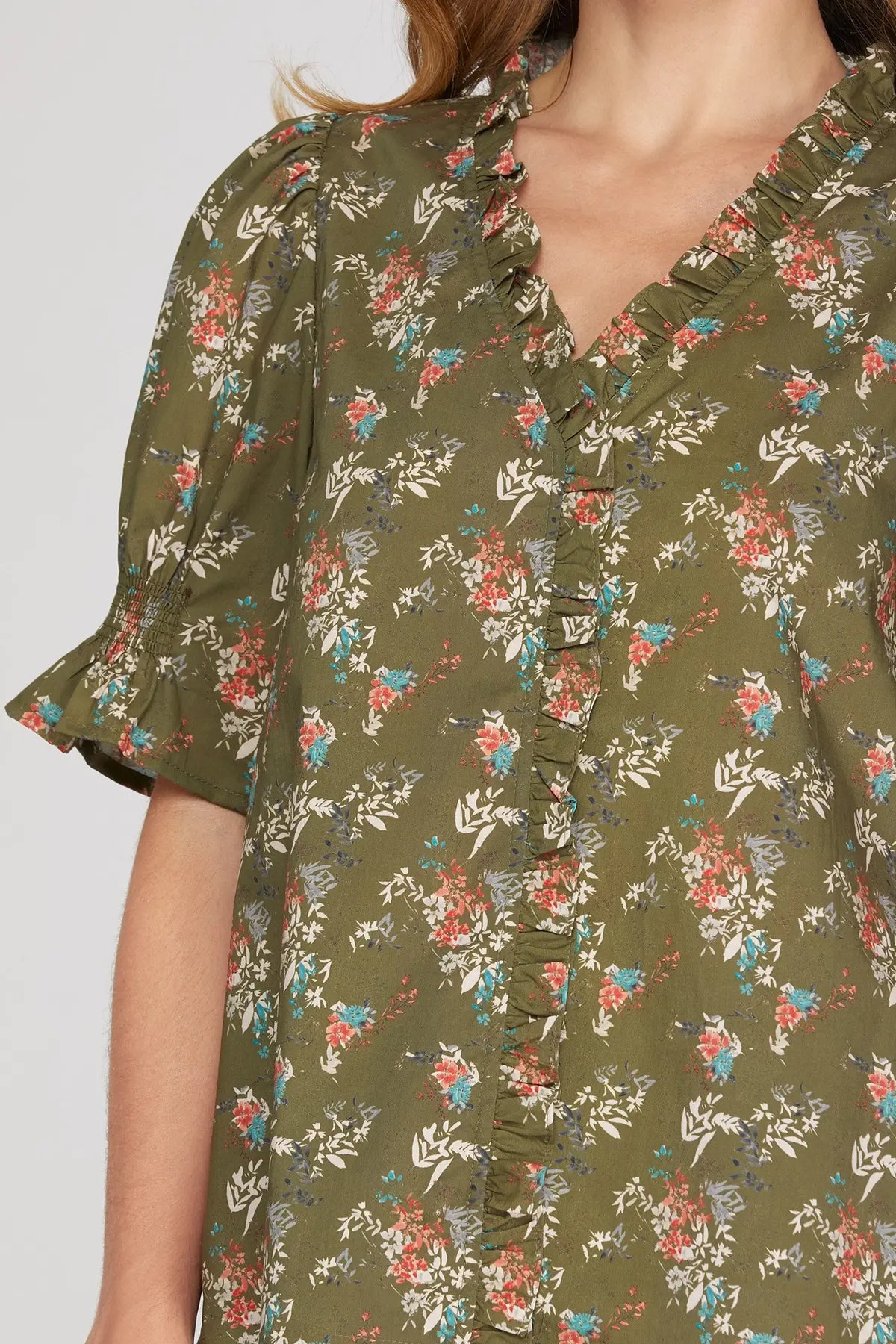 Brown floral ruffle-neck blouse back view
